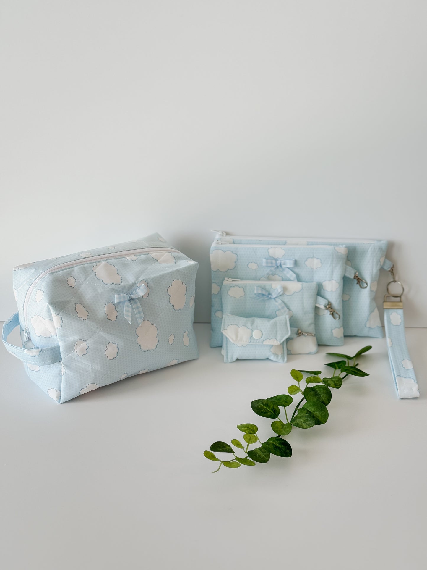Handmade quilted makeup bag with light blue cloud pattern