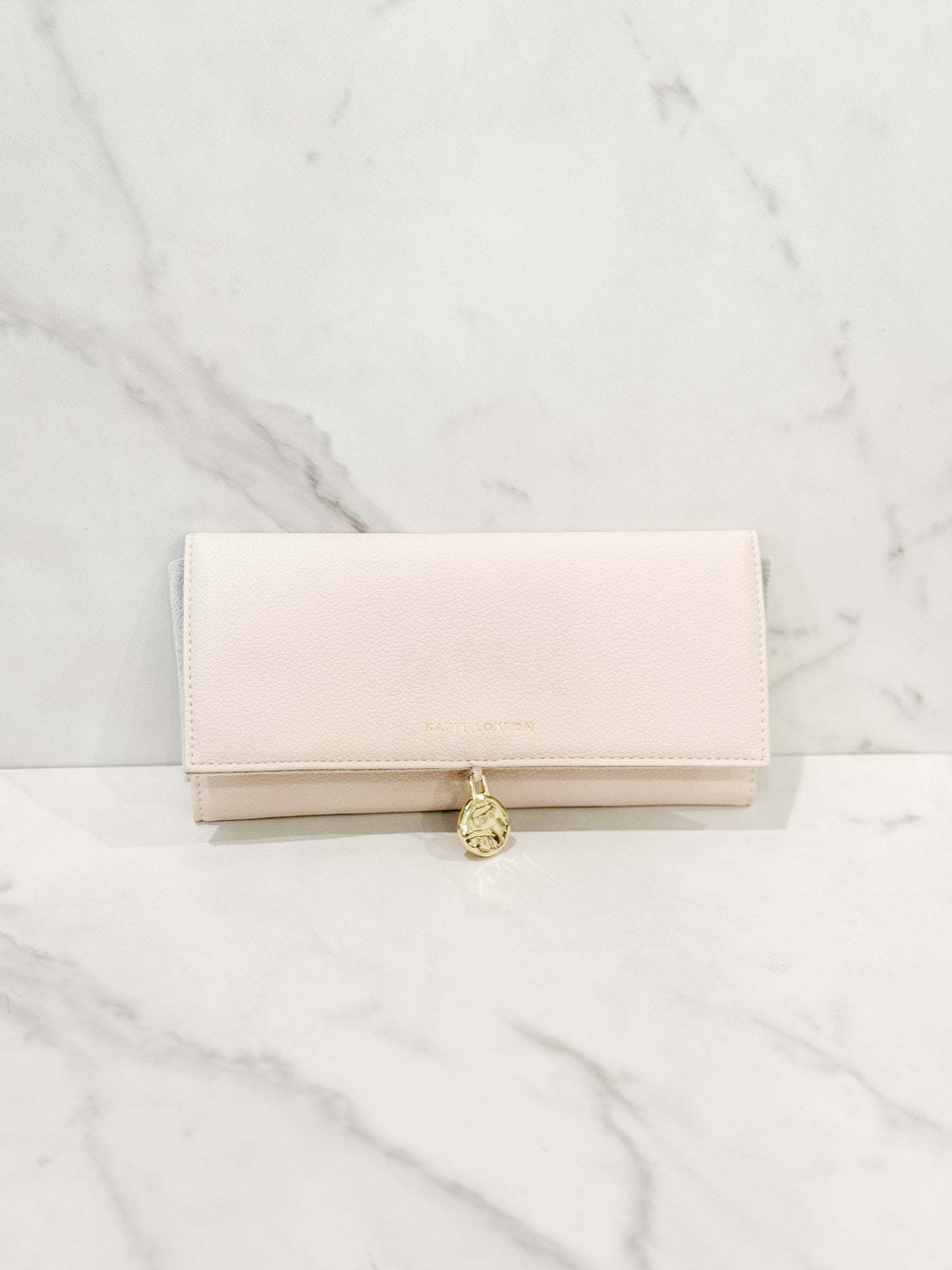 Katie Loxton vegan leather jewelry pouch in the color eggshell