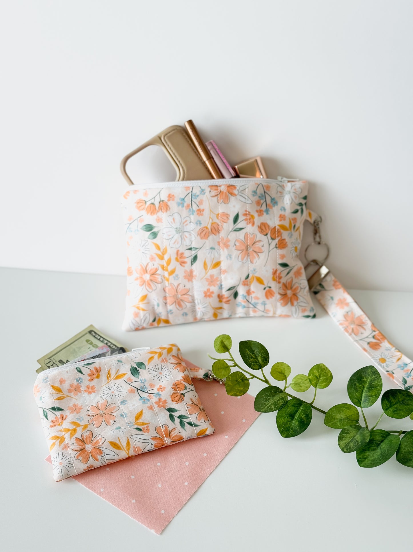 Medium handmade Peach Blossom Meadow floral zipper pouch styled with our peach blossom coin purse