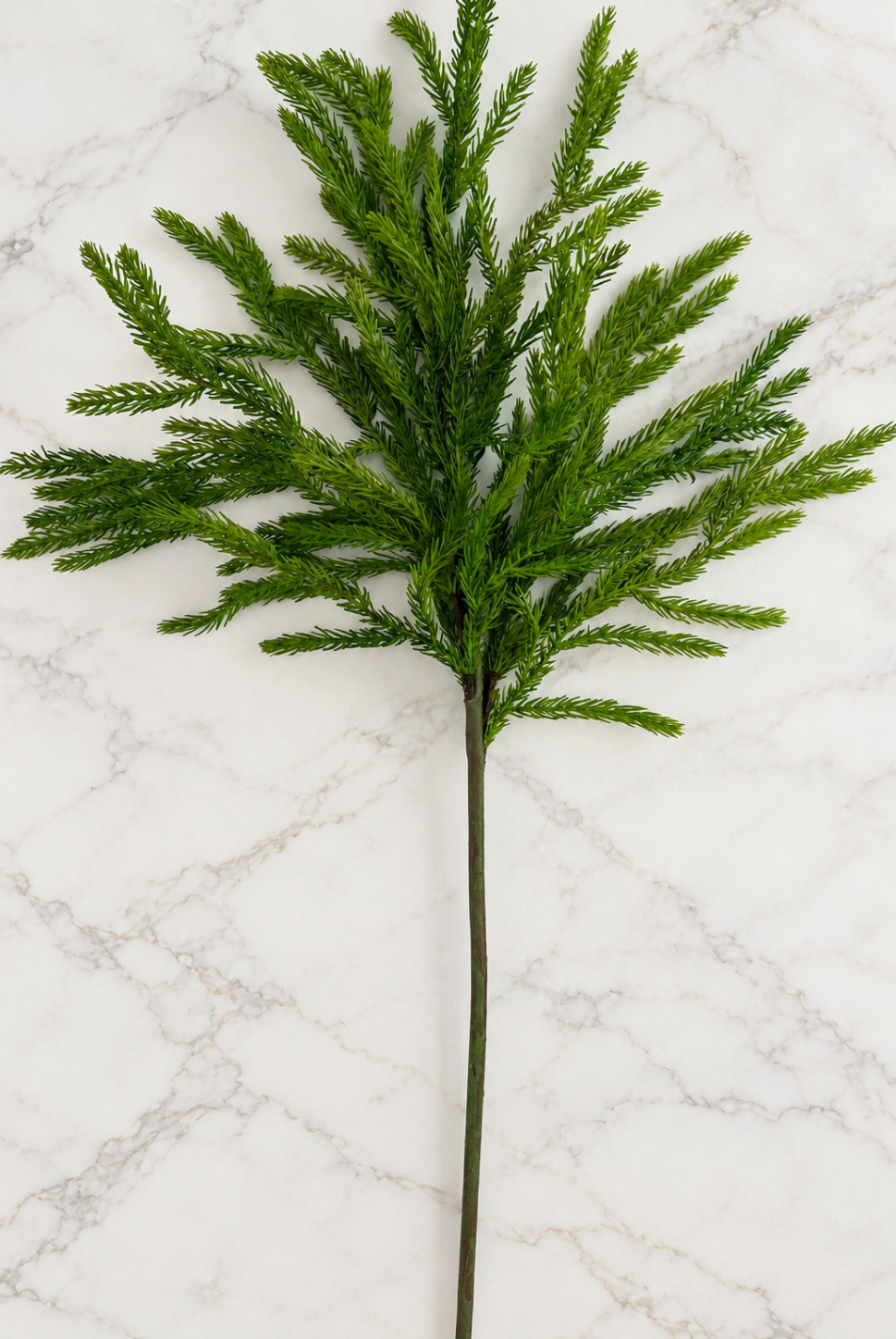 29-inch Real Touch Norfolk Pine stem featuring lifelike green foliage and delicate, flexible branches, photographed individually against a neutral marble background.