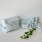 Handmade quilted makeup bag with light blue cloud pattern