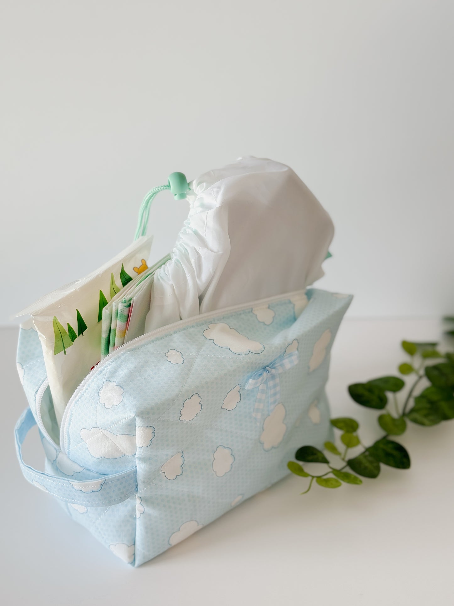 Blue Skies quilted cosmetic bag with zipper and handle