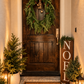 Creative Co-Op “Joy” doormat styled at front door with holiday greenery