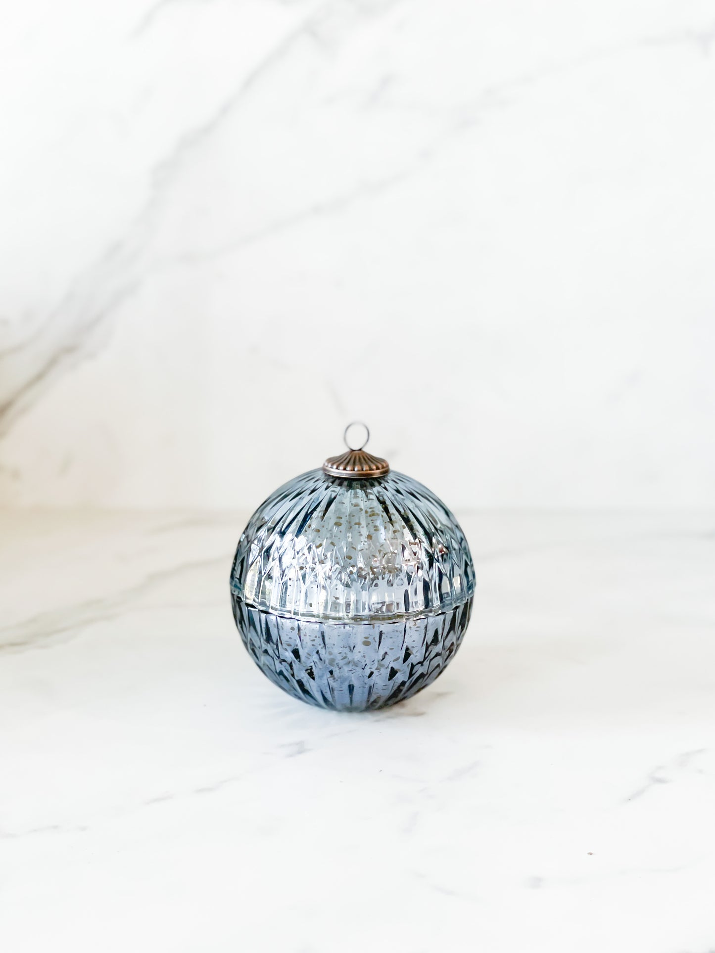 Blue ornament candle with notes of fir,citrus and black currant