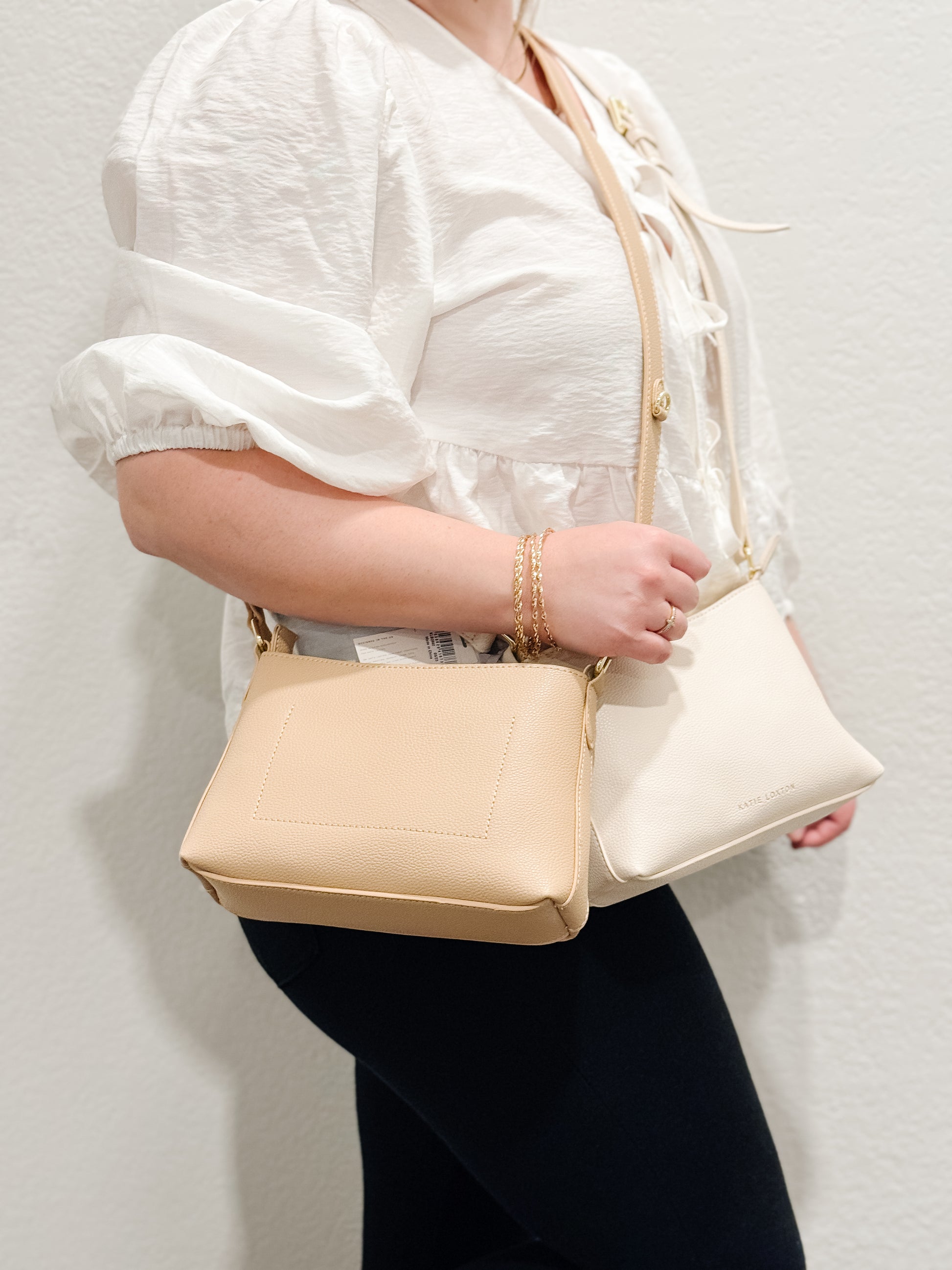 Evie Crossbody Bag in Soft Tan and Eggshell with adjustable strap, perfect for casual and formal outfits.