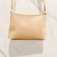 Front vie of the Evie Crossbody bag in soft tan