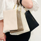 Katie Loxton Zana wristlet pouch in black vegan leather with gold zip, mink vegan leather with gold zip,eggshell and cream
