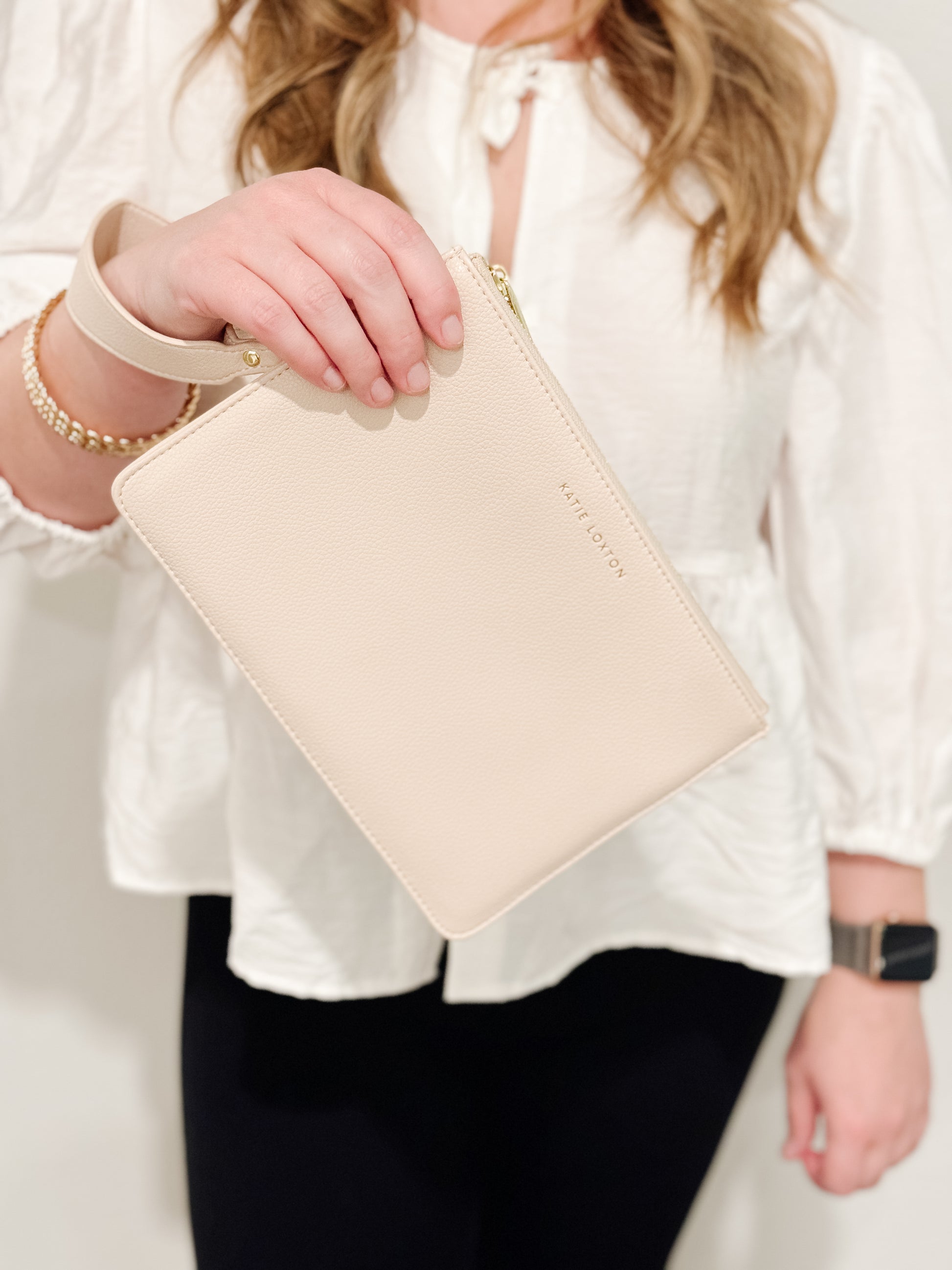 Katie Loxton Zana wristlet pouch made of soft vegan leather in the color eggshell