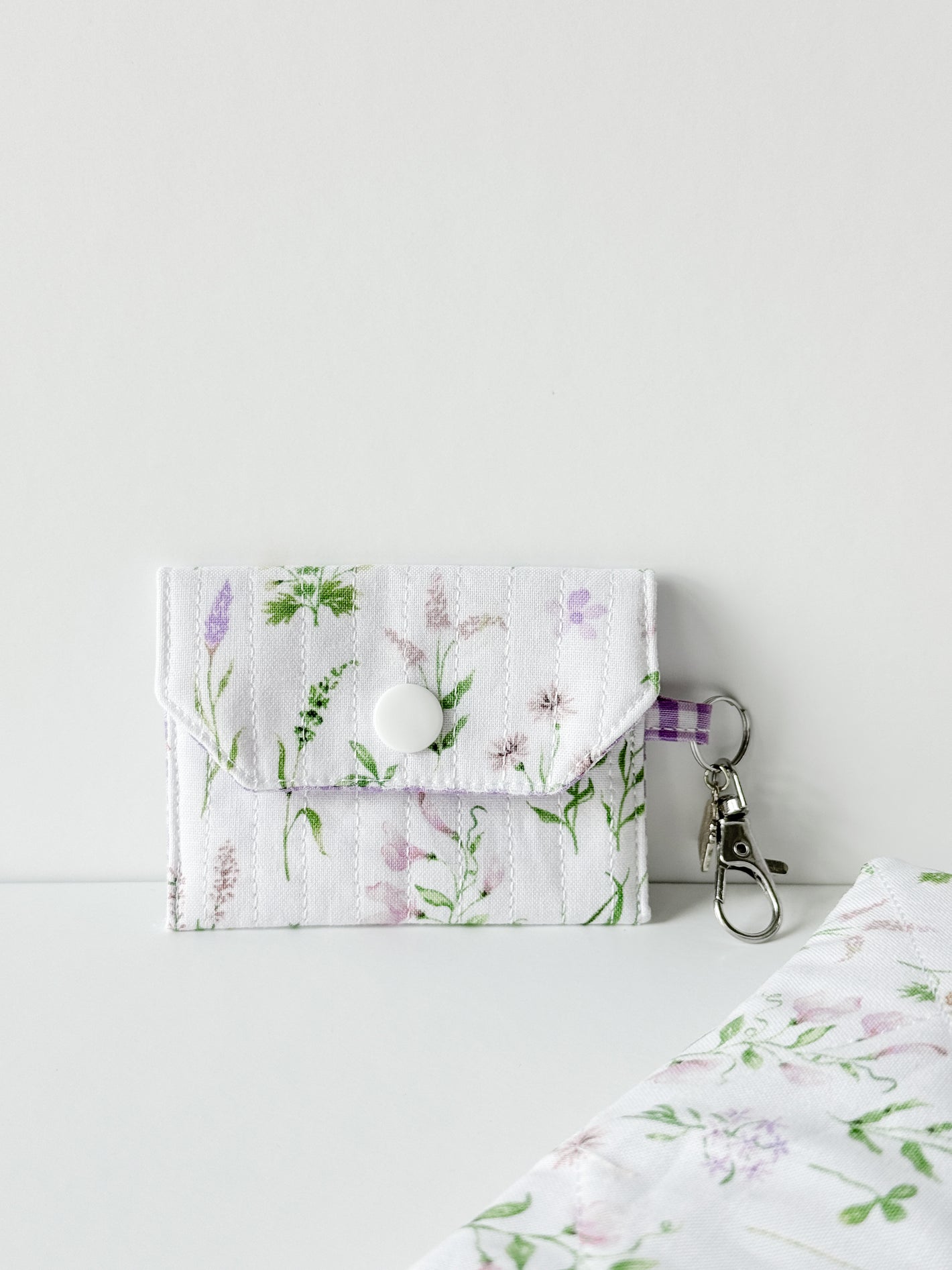 Handmade Lavender Meadow AirPods Case featuring a lavender floral quilted cotton pattern