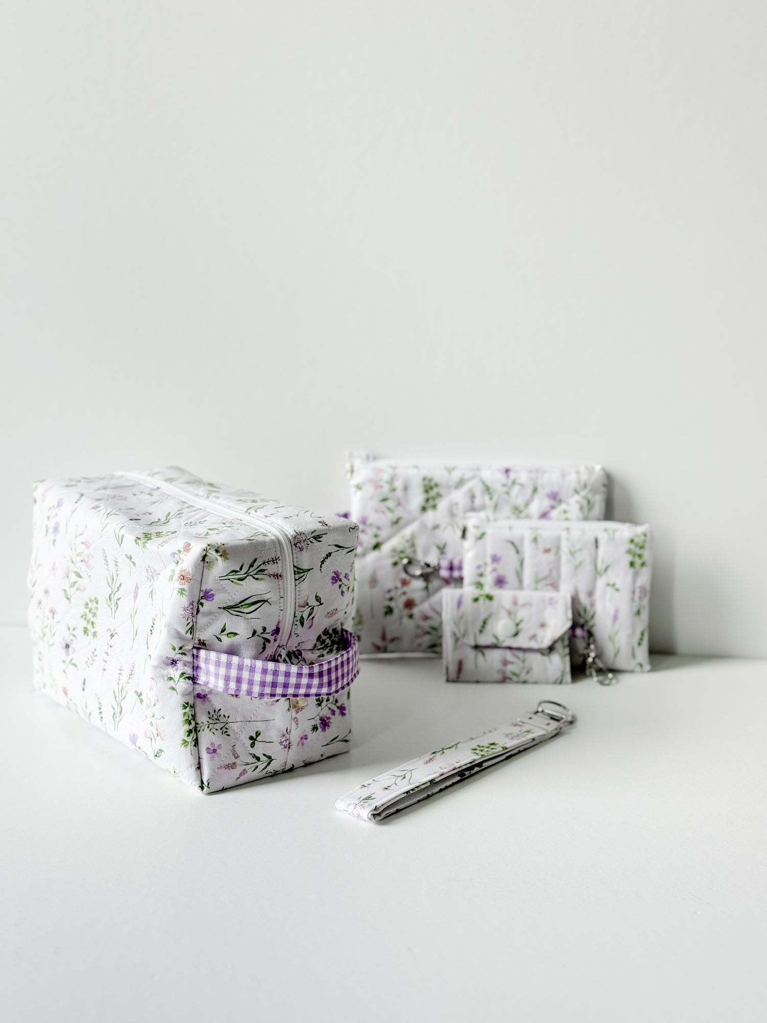 Handmade Lavender Meadow Quilted Cotton collection featuring a gingham lavender interior and floral quilted cotton pattern 