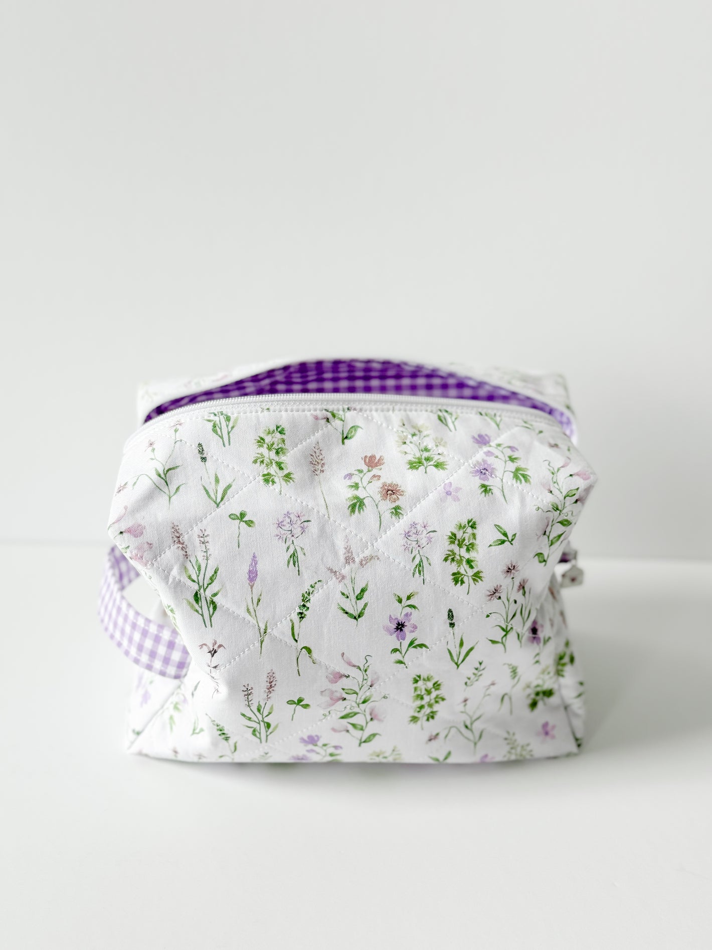 Handmade Lavender Meadow Quilted Cotton Makeup Bag featuring a lavender floral quilted cotton pattern