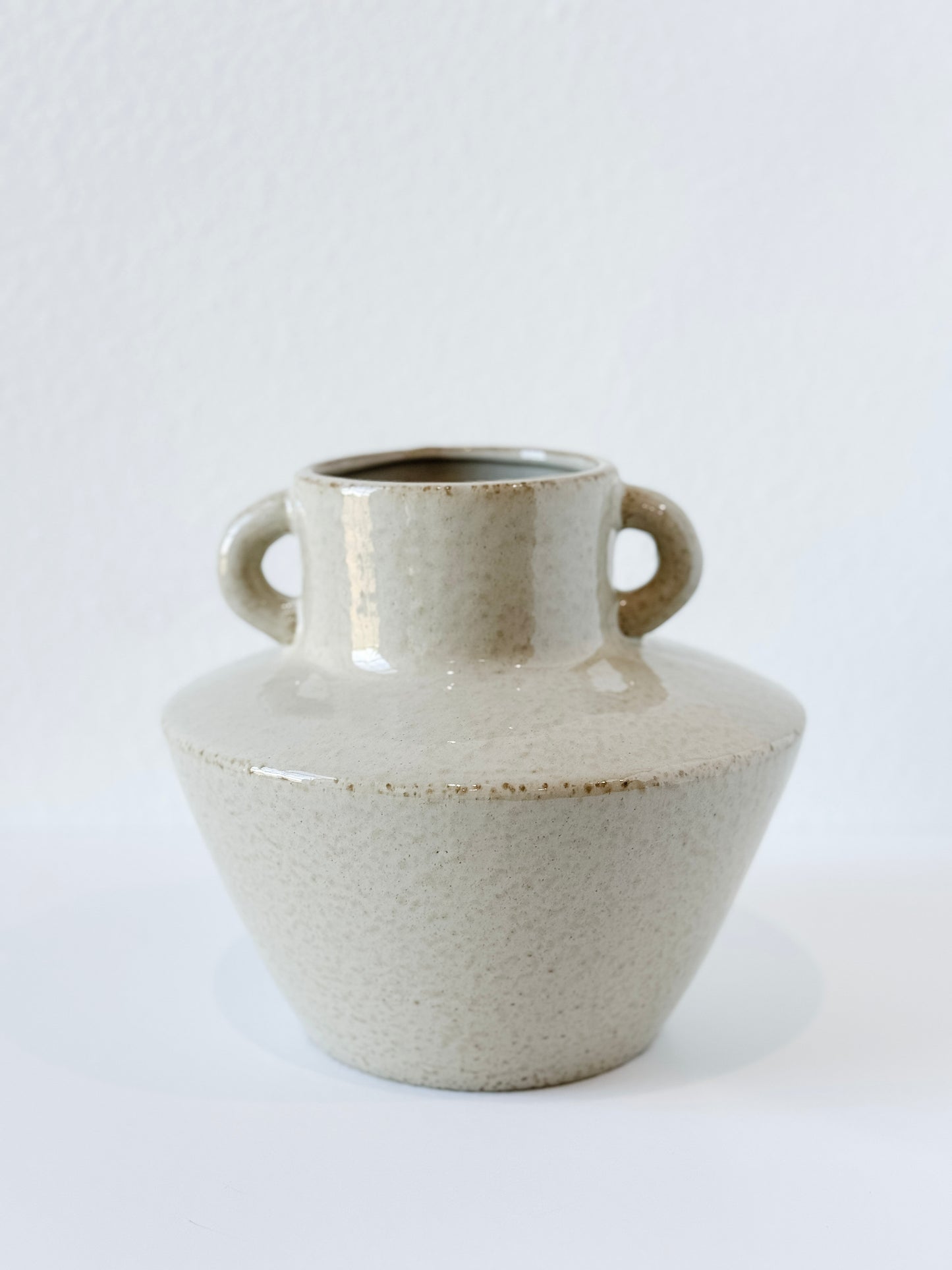 Handmade neutral stoneware vase with handles