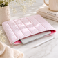 Pink floral quilted iPad sleeve styled on marble desk with tablet, neutral decor, and feminine workspace accessories