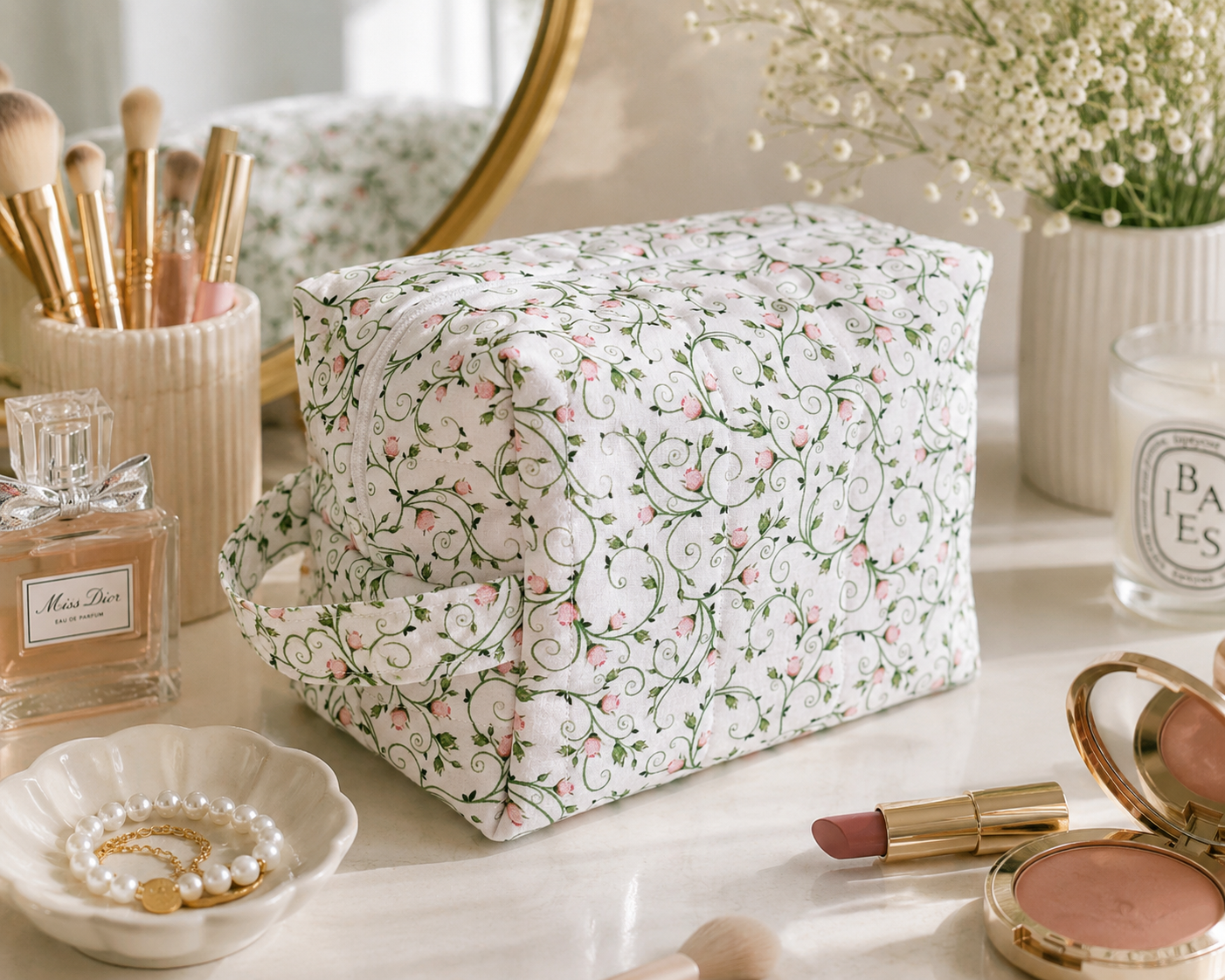 Pink Ribbon quilted makeup bag featuring a soft pink bow print with coordinating gingham bow detail, styled on a bright vanity with everyday beauty essentials.
