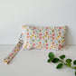 Sew Hailey Said floral handmade quilted wristlet pouch with floral handle from the petal and posies wildflower and bow collection