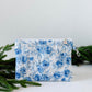 Small floral quilted wristlet pouch with blue gingham lining