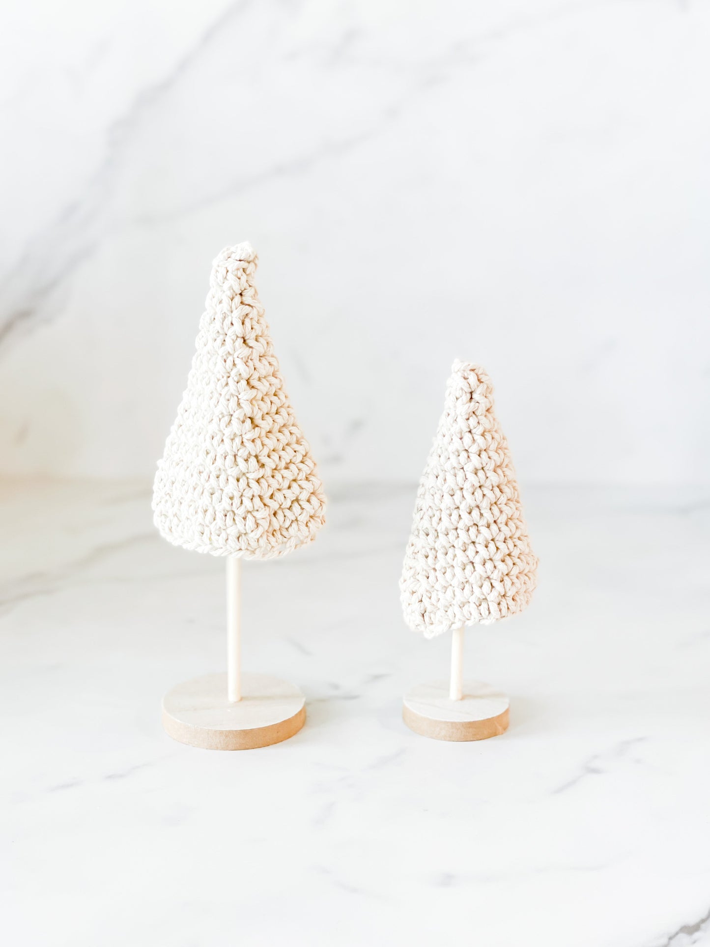 Set of cream crochet Christmas trees on wooden bases