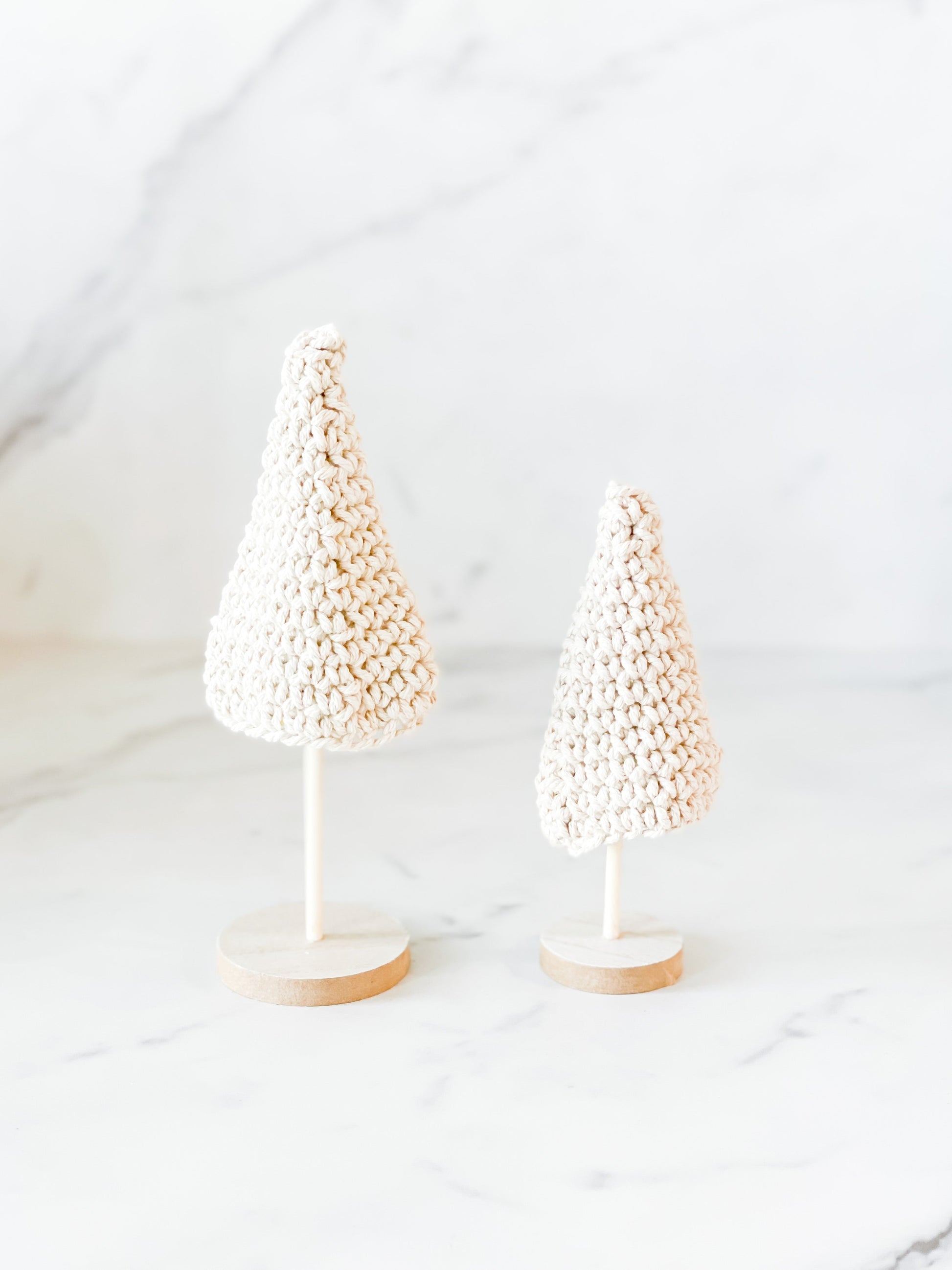 Set of cream crochet Christmas trees on wooden bases