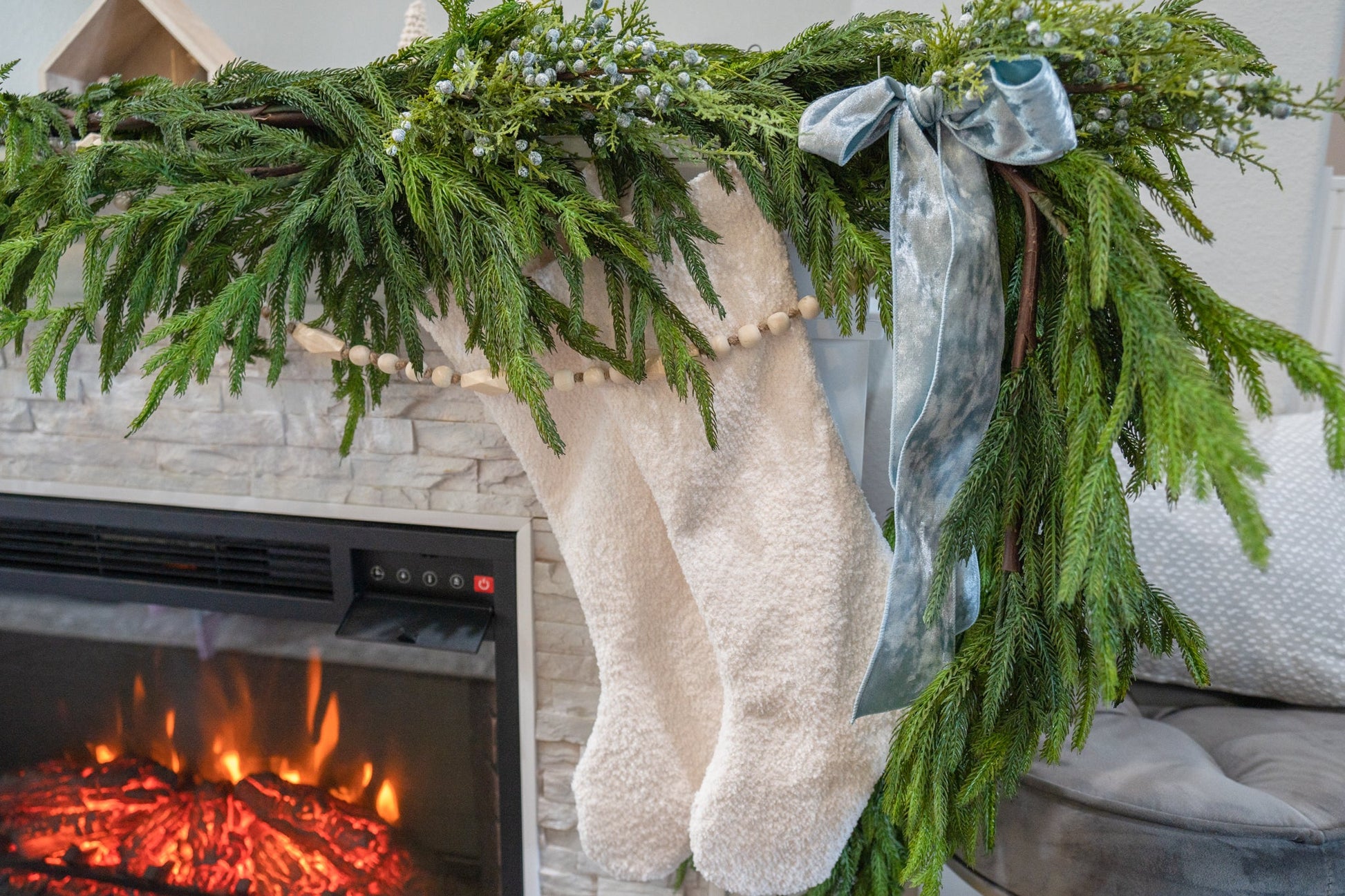 6ft Real Touch Norfolk Garland styled on a holiday mantel