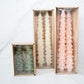Packaging of white, pink & green tree taper candles set of 2