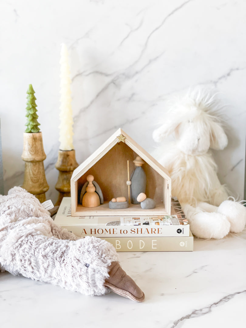 White tree taper candles styled on a winter holiday table